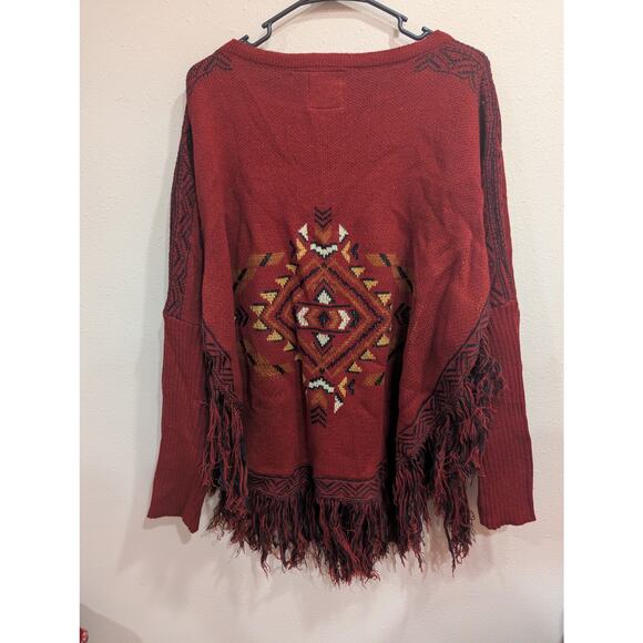 Southwestern style rust colored sweater with fringe detailing by Cotton & Rye - Picture 3 of 8